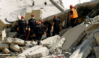 Погибших гаитян хоронят в братских могилах Погибших гаитян хоронят в братских могилах