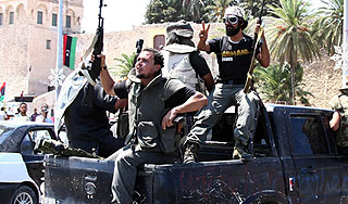 Повстанцы решили расстрелять Каддафи Повстанцы решили расстрелять Каддафи