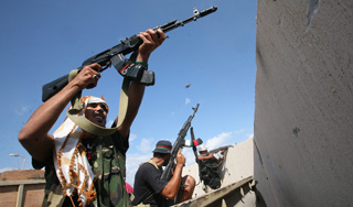 Каддафи проиграл битву за последний город Каддафи проиграл битву за последний город